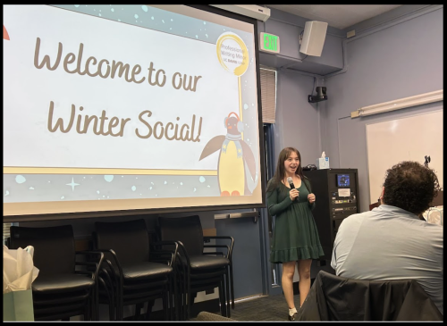 Photo of Emilie Schwarz hosting a social event for faculty and students